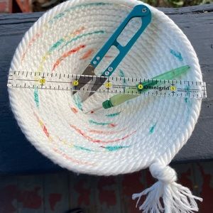 Handmade Cotton Rope Basket with bright orange/yellow and teal accents added.